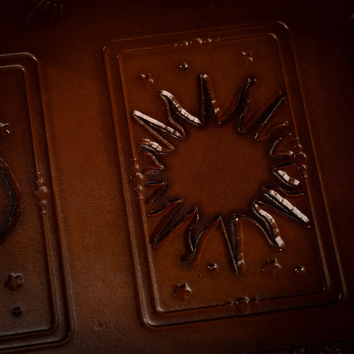 Close view of the sun card placement at the centre of The Astro leather tarot mat