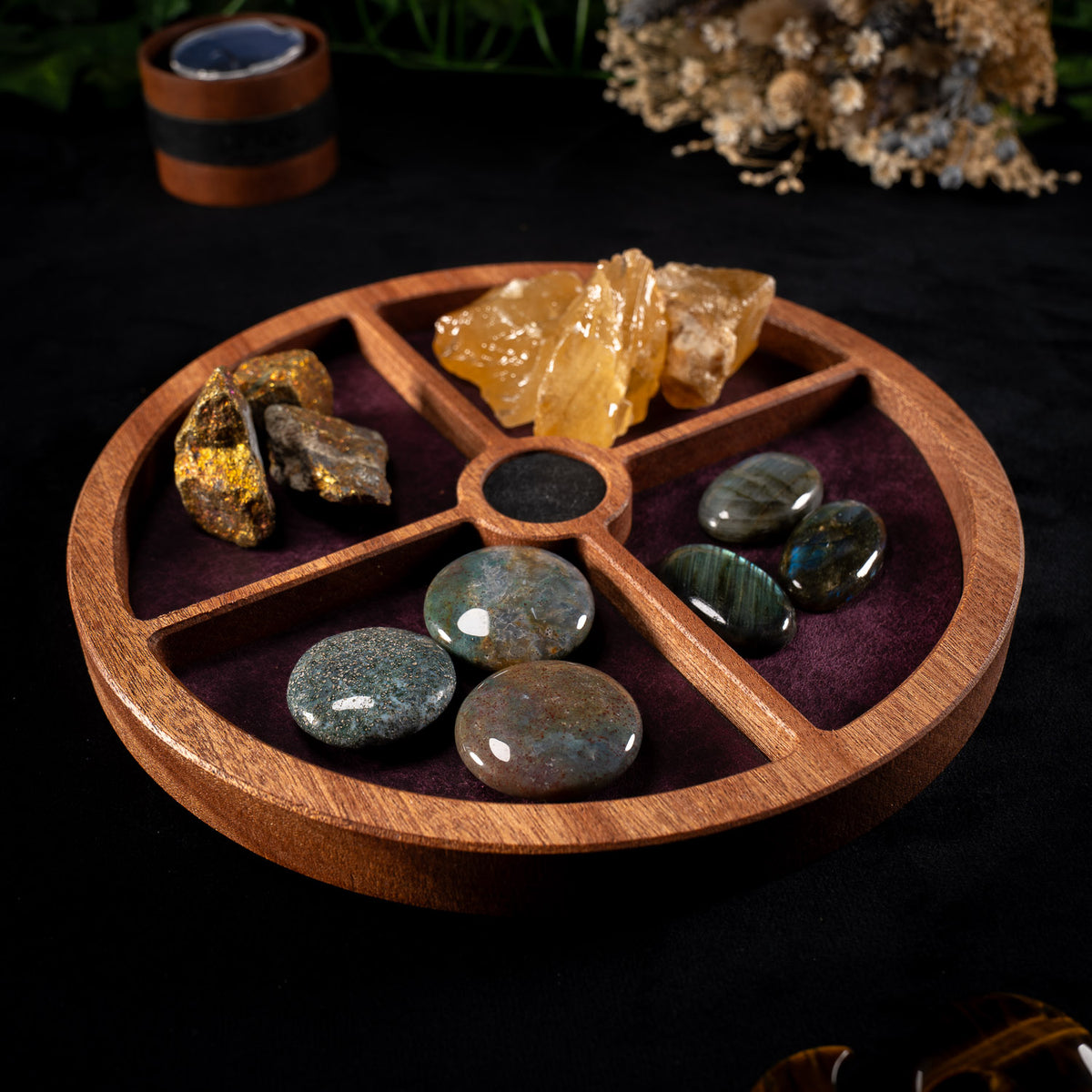 Handmade sapele crystal organiser with four leather-lined compartments holding crystals