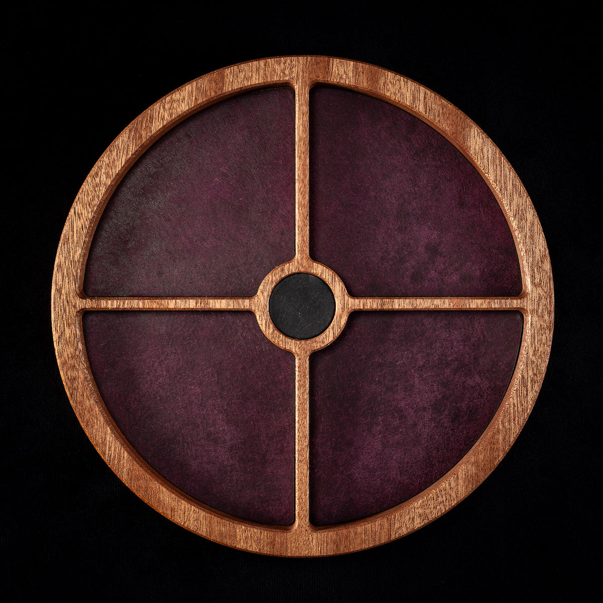 Round wooden crystal organiser in solid sapele, with a centre well and four compartments