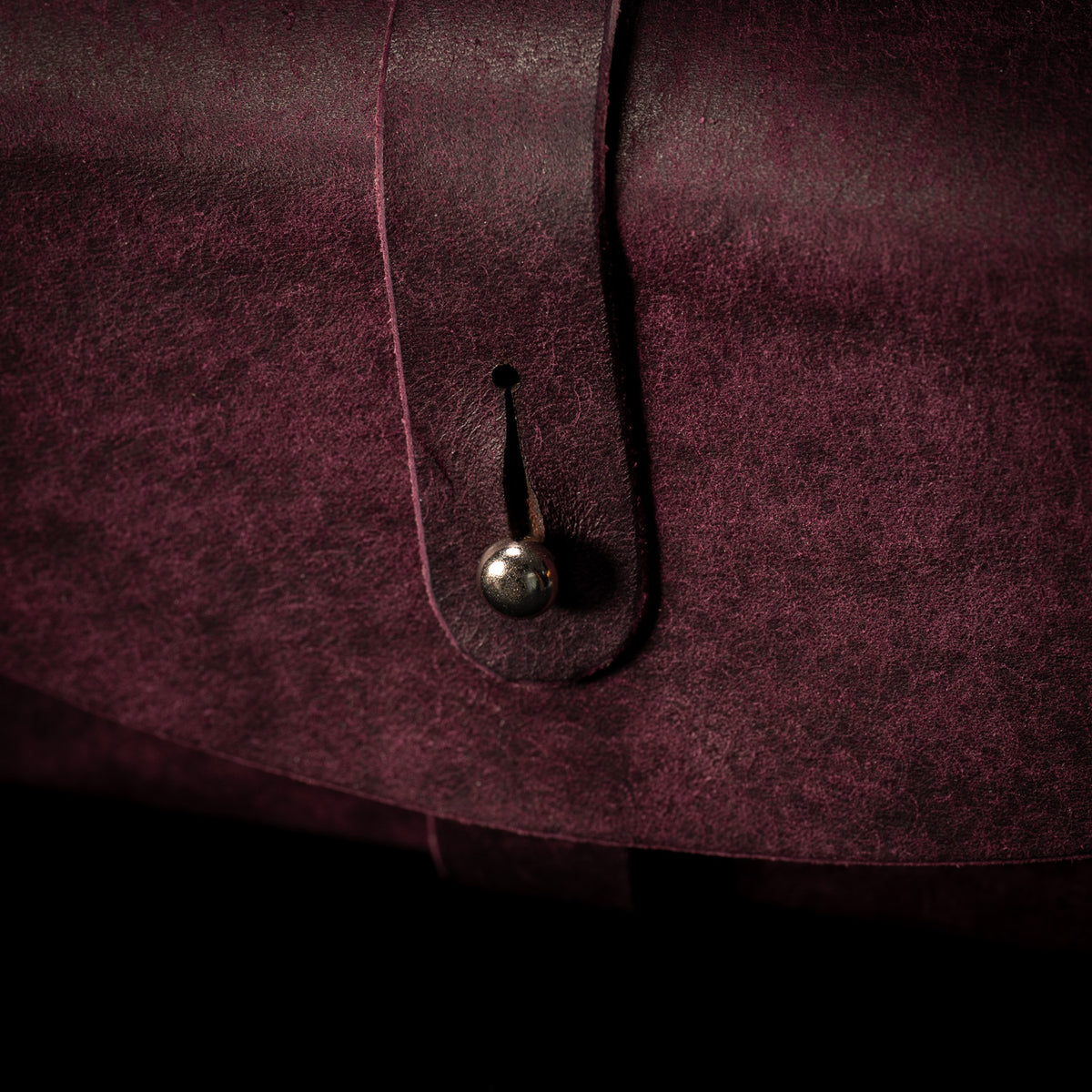 Close up of the keyhole slot and collar button fastening on the Prugna Cosmic Shroud strap