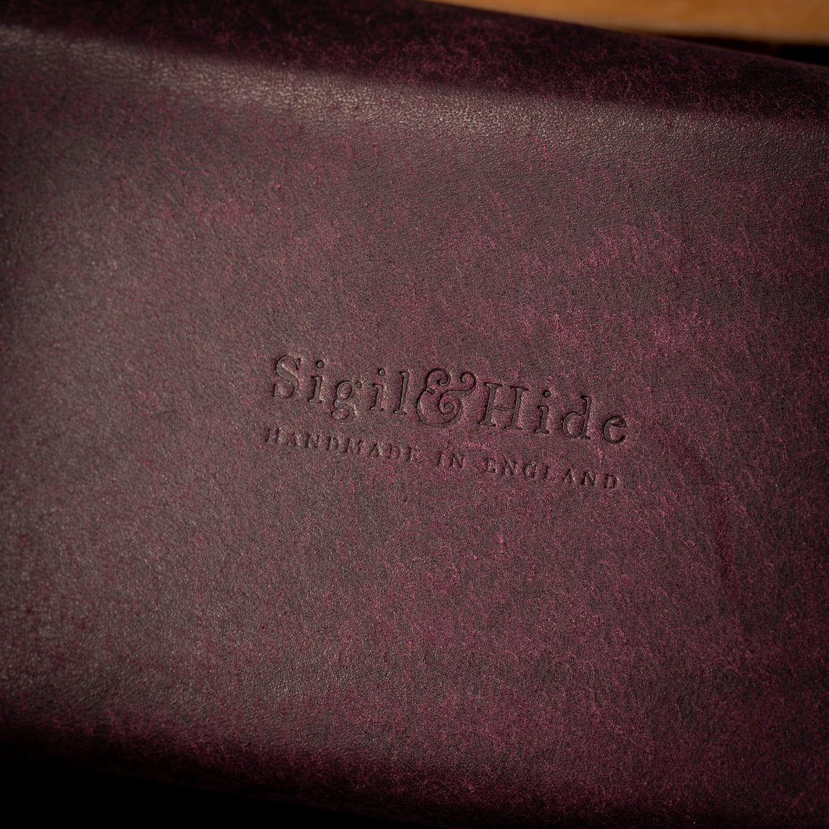 Close up of the Sigil and Hide maker's mark, Handmade in England, embossed into Prugna Pueblo leather