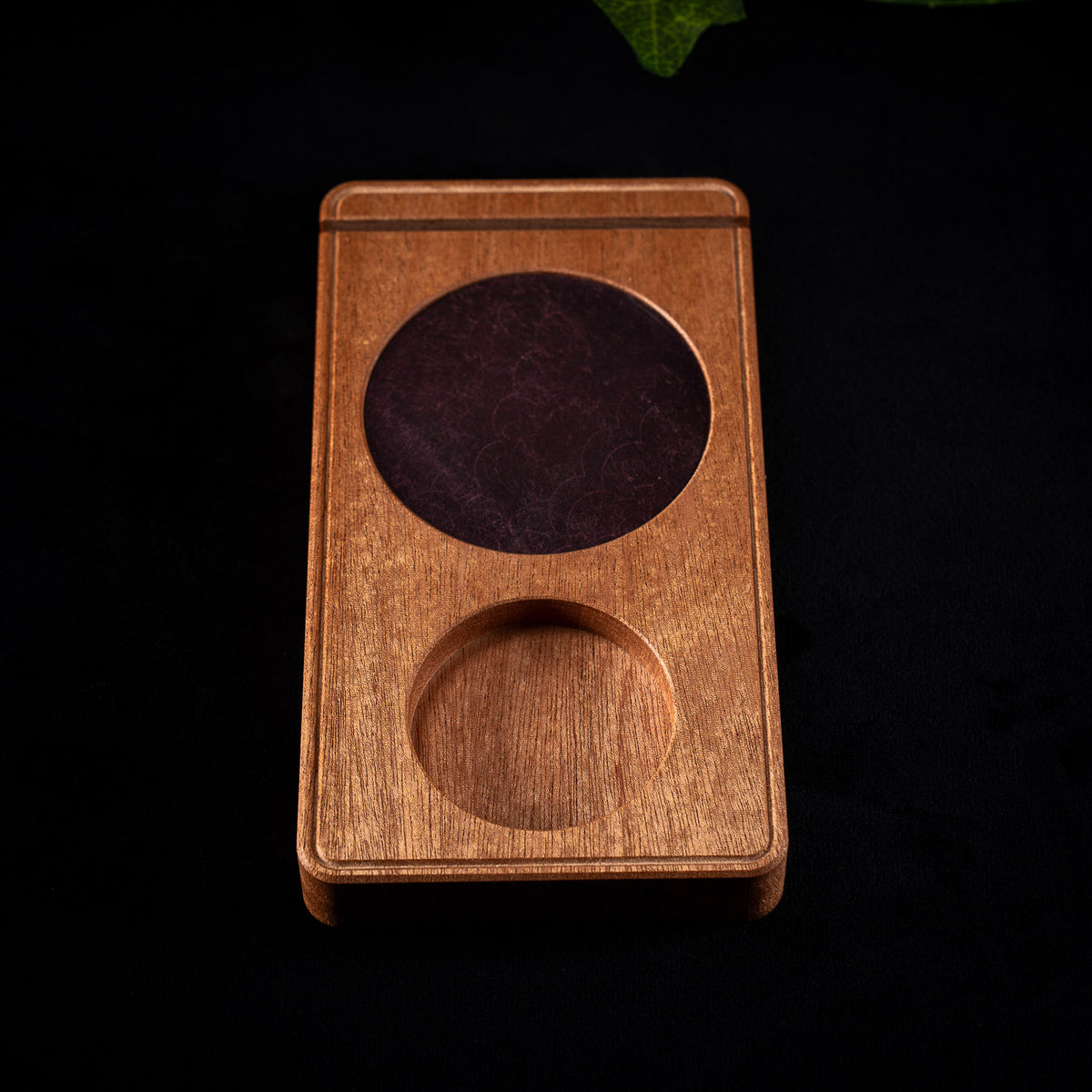 Detail of the Vesper wooden altar showing the leather inlay in sapele
