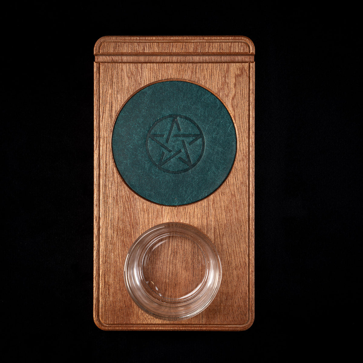 The Vesper sapele altar piece holding a single tarot card by candlelight